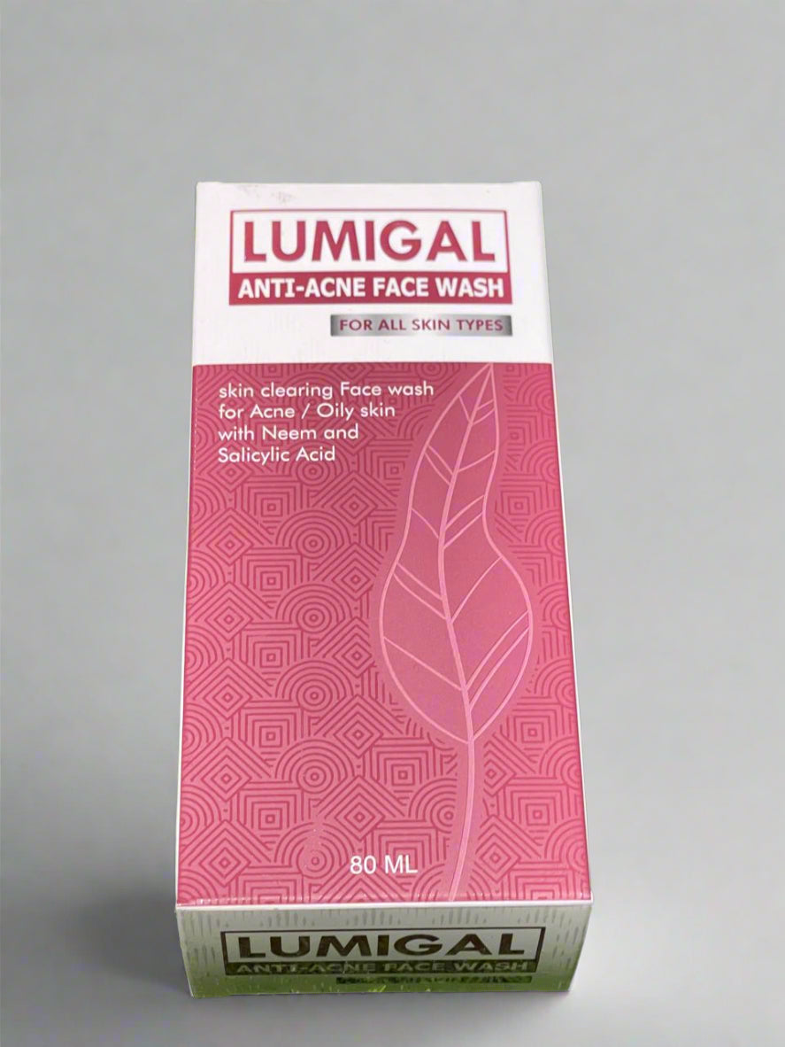 A box of Lumigal Anti-Acne Face Wash placed on grass, with packaging that includes the product name and a leaf symbol.