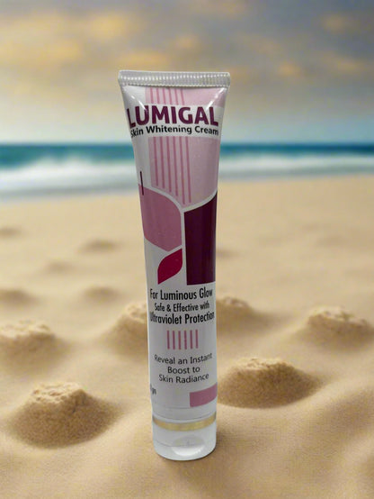 Lumigal skin whitening cream tube on a white surface with a blurred background