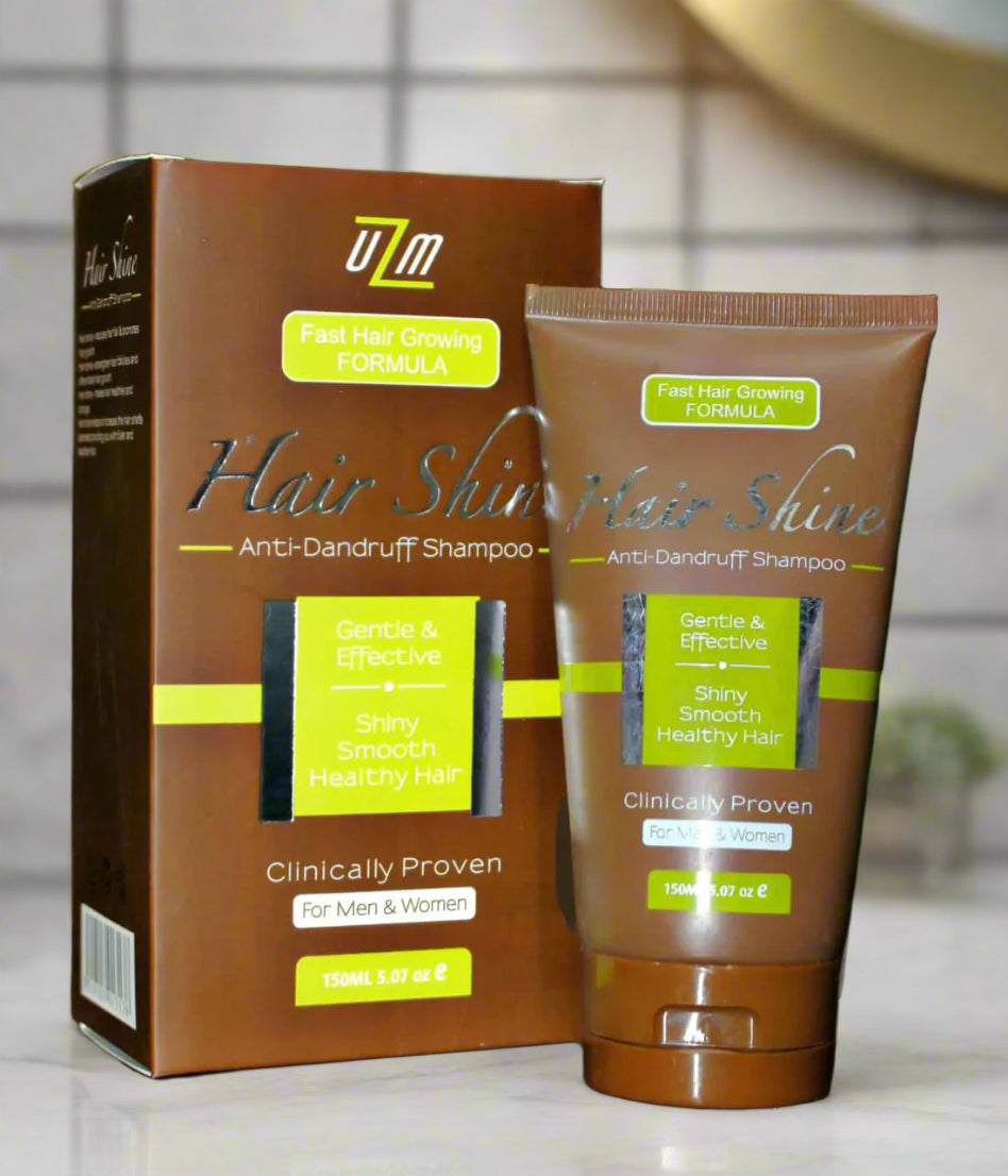 This image displays a product called "Hair Shine Shampoo," which is marketed as an anti-dandruff formula. The packaging includes a brown bottle with a white label that features text and branding, along with a matching brown box that has additional information and claims.