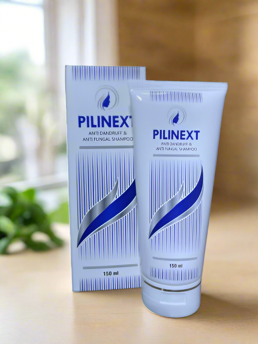 This image features a package and tube of Pilinext Shampoo, designed for hair care. The package, including a box and a tube, displays a clean, professional look with a predominantly white color accented by blue stripes.