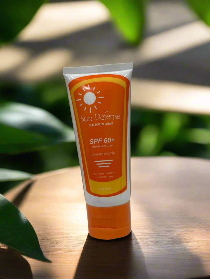 Sun Defense SPF 60+ sunscreen tube on a white surface